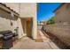 Small backyard with a grill and access to the interior at 4924 Conglobate St, Las Vegas, NV 89122