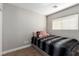 Cozy bedroom with window and plush bedding at 4924 Conglobate St, Las Vegas, NV 89122