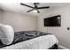 Bedroom with a double bed, ceiling fan, and mounted TV at 4924 Conglobate St, Las Vegas, NV 89122