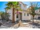 Two story house with attached garage and desert landscaping at 4924 Conglobate St, Las Vegas, NV 89122