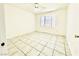 Bedroom with tile floors, ceiling fan, and bay window at 5086 Jeffreys St # 201, Las Vegas, NV 89119