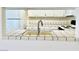 Kitchen features a double sink and white cabinetry at 5086 Jeffreys St # 201, Las Vegas, NV 89119