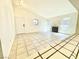 Bright living room with tile floors, fireplace, and vaulted ceiling at 5086 Jeffreys St # 201, Las Vegas, NV 89119