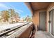 Private balcony overlooking a tree-lined community at 5261 Mission Carmel Ln # 202, Las Vegas, NV 89107