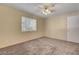Well-lit bedroom with carpet flooring and ceiling fan at 5261 Mission Carmel Ln # 202, Las Vegas, NV 89107