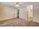 Primary bedroom with carpet, ceiling fan, and access to bathroom at 5261 Mission Carmel Ln # 202, Las Vegas, NV 89107