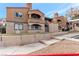 Tan two-story building with a gated entrance at 5261 Mission Carmel Ln # 202, Las Vegas, NV 89107