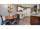 Bright kitchen with wood-look floors and white appliances at 5261 Mission Carmel Ln # 202, Las Vegas, NV 89107