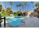 Inviting community swimming pool surrounded by palm trees at 5261 Mission Carmel Ln # 202, Las Vegas, NV 89107