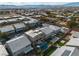 Aerial view of neighborhood featuring modern homes, pools, and mountain views at 6276 Olde Lockford Ct, Las Vegas, NV 89139