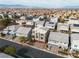 Expansive aerial view of a vibrant residential neighborhood with diverse home styles and mountain views at 6276 Olde Lockford Ct, Las Vegas, NV 89139