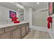 Spacious bathroom featuring double sinks, ample counter space, and a shower-tub combo at 6276 Olde Lockford Ct, Las Vegas, NV 89139