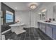 Beautiful bathroom boasts a freestanding tub, black tile flooring and modern fixtures at 6276 Olde Lockford Ct, Las Vegas, NV 89139