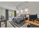 Bright bedroom features recessed lights, backyard access, and a modern desk area at 6276 Olde Lockford Ct, Las Vegas, NV 89139
