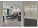 Comfortable bedroom features recessed lights, backyard access, and a view into the modern bathroom at 6276 Olde Lockford Ct, Las Vegas, NV 89139