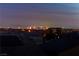Enjoy the illuminated skyline from this elevated neighborhood vantage point with homes with rooftop solar panels at 6276 Olde Lockford Ct, Las Vegas, NV 89139