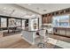 Open-concept kitchen with center island, pendant lighting, and stainless steel appliances at 6276 Olde Lockford Ct, Las Vegas, NV 89139