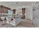 Well-equipped kitchen featuring wood cabinetry, quartz counters, and a spacious island, designed for culinary enthusiasts and everyday use at 6276 Olde Lockford Ct, Las Vegas, NV 89139