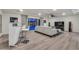 Open-concept living room with recessed lights, bar area, and access to backyard pool at 6276 Olde Lockford Ct, Las Vegas, NV 89139