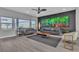 Bright and airy living room featuring sleek furnishings, recessed lighting, and large windows at 6276 Olde Lockford Ct, Las Vegas, NV 89139