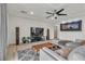 Bright living room with coffered ceiling, gray sectional sofa, and large entertainment center at 6276 Olde Lockford Ct, Las Vegas, NV 89139