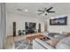 Comfortable living room with recessed ceilings and a large flat screen television and a modern entertainment center at 6276 Olde Lockford Ct, Las Vegas, NV 89139