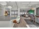 Open-concept living area boasts stainless steel appliances, a large island, and seamless flow to the dining space at 6276 Olde Lockford Ct, Las Vegas, NV 89139