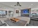 Open-concept living room with modern fireplace, sleek furniture, and stylish decor at 6276 Olde Lockford Ct, Las Vegas, NV 89139