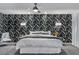 Spacious main bedroom with striking accent wall, plush gray carpeting and ample natural light at 6276 Olde Lockford Ct, Las Vegas, NV 89139