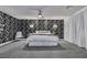 Spacious main bedroom with striking accent wall, plush gray carpeting and ample natural light at 6276 Olde Lockford Ct, Las Vegas, NV 89139