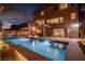 Backyard pool with integrated spa and cozy outdoor dining area at 6276 Olde Lockford Ct, Las Vegas, NV 89139