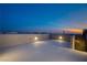 A spacious rooftop deck with outdoor lighting provides an open-air place to enjoy the colorful evening sky at 6276 Olde Lockford Ct, Las Vegas, NV 89139