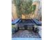 Outdoor hot tub and patio area with atmospheric lanterns for relaxing evenings at 6687 Keyesport Ct, Las Vegas, NV 89148