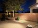 Well-lit backyard with brick retaining wall, paver patio, and gravel landscaping offers a private and inviting outdoor space at 6886 Barred Dove Ln, North Las Vegas, NV 89084