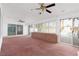 Sunroom with brick wall, pool view, and sliding glass doors at 7520 W Wigwam Ave, Las Vegas, NV 89113