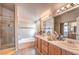 Relaxing bathroom with double vanity, soaking tub and shower at 7873 Cherry River Dr, Las Vegas, NV 89145