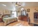 Spacious main bedroom with wood floors and ceiling fan at 7873 Cherry River Dr, Las Vegas, NV 89145