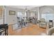 Dining area with hardwood floors, table, and chairs, near kitchen at 7950 W Flamingo Rd # 1054, Las Vegas, NV 89147