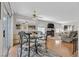 Bright dining area with hardwood floors, table for four, and living room view at 7950 W Flamingo Rd # 1054, Las Vegas, NV 89147