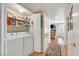 Convenient laundry room with washer, dryer, and shelving at 7950 W Flamingo Rd # 1054, Las Vegas, NV 89147