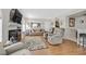 Spacious living room with hardwood floors, fireplace, and comfy seating at 7950 W Flamingo Rd # 1054, Las Vegas, NV 89147