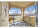 Small patio with wrought iron chairs and small grill at 7950 W Flamingo Rd # 1054, Las Vegas, NV 89147