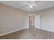 Spacious bedroom with wood-look floors and ceiling fan at 830 Carnegie St # 1712, Henderson, NV 89052