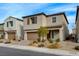 Two-story house with brown garage door and landscaping at 8372 Brimson St, Las Vegas, NV 89148