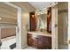 Bathroom with a vanity, shower, and access to backyard at 9113 Golden Eagle Dr, Las Vegas, NV 89134