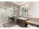 Modern bathroom with double vanities, a large walk-in shower, and sleek fixtures at 9113 Golden Eagle Dr, Las Vegas, NV 89134