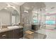 Large bathroom with a walk-in shower and double vanities at 9113 Golden Eagle Dr, Las Vegas, NV 89134