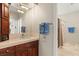 Bathroom with a vanity, shower and a window at 9113 Golden Eagle Dr, Las Vegas, NV 89134