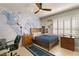 Bedroom with a world map mural and wooden furniture at 9113 Golden Eagle Dr, Las Vegas, NV 89134