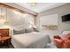 Bright bedroom with a comfortable bed and an accent chair at 9113 Golden Eagle Dr, Las Vegas, NV 89134